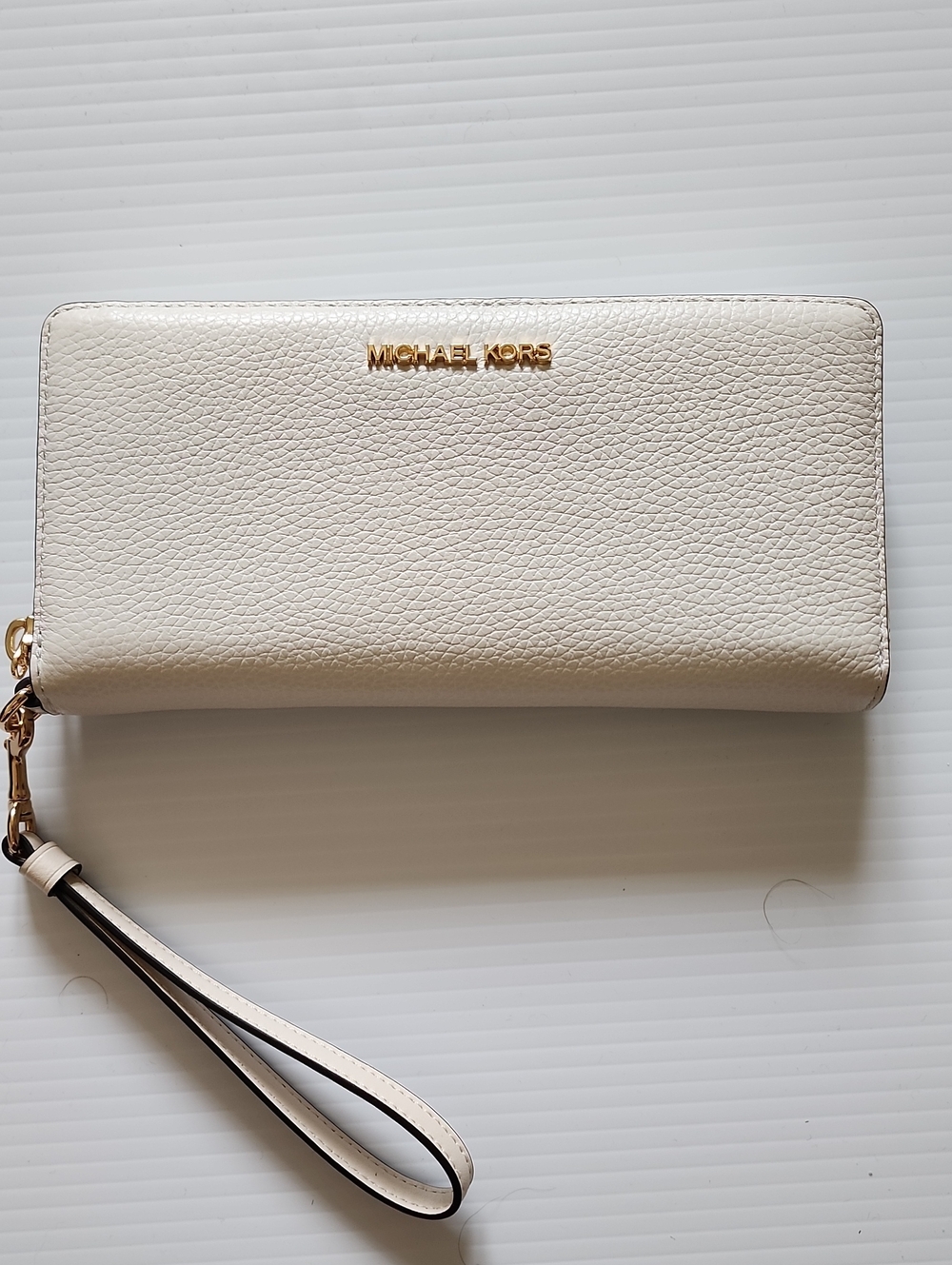 Michael Kors Cream Pebble Leather Wristlet with Gold Logo
